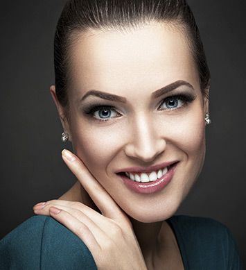 facial procedures feature Woman smiling after getting facial procedure from Chicago Plastic Surgery LLC